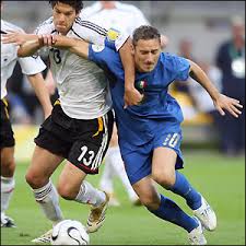 ... and Francesco Totti fight for ...