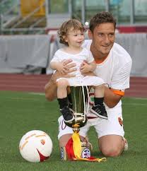 Totti and his equally gorgeous wife ...